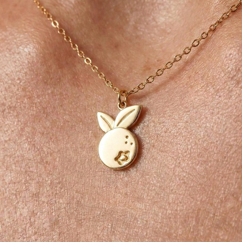 Small gold blueberry pendant with a star-shaped crown on a fine cable chain