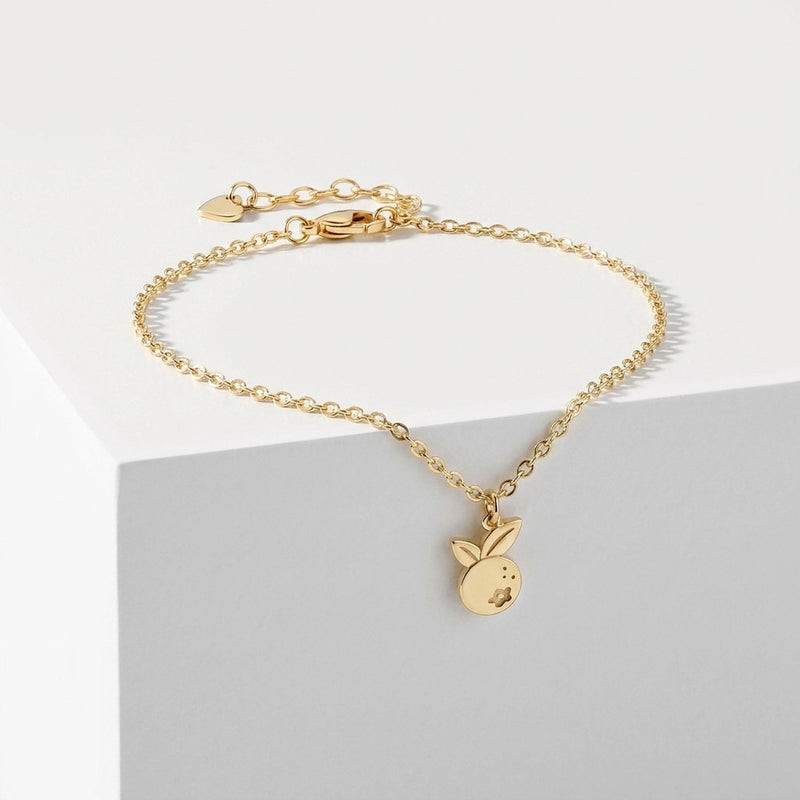 Fine gold chain bracelet with a single small blueberry charm (2 of 7)