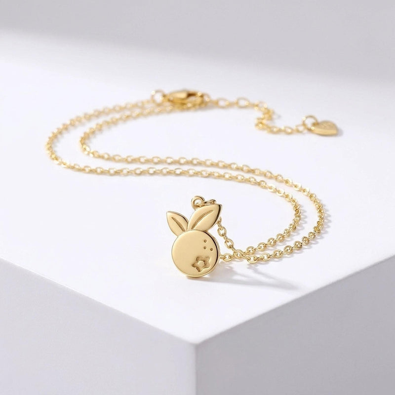 Fine gold chain bracelet with a single small blueberry charm (3 of 7)