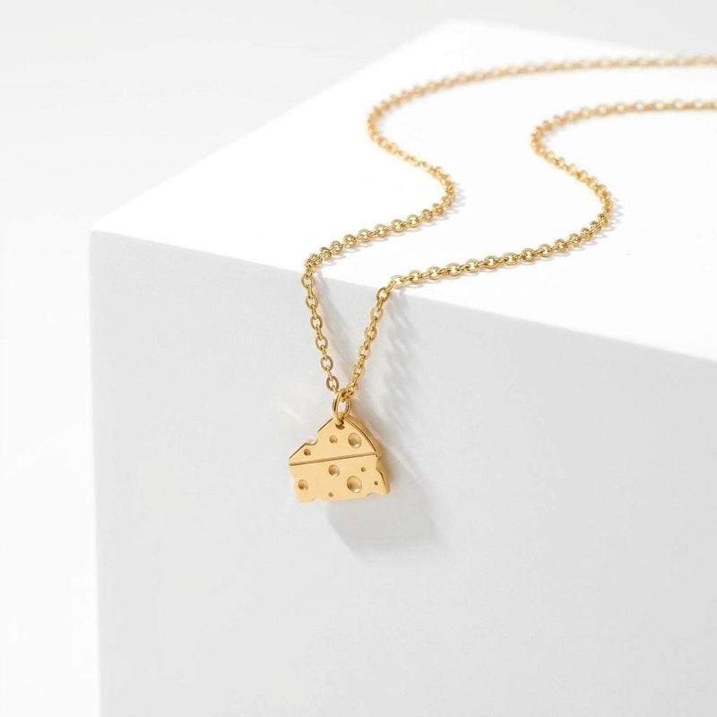 Small gold Swiss cheese wedge pendant with round holes on a fine cable chain (3 of 6)
