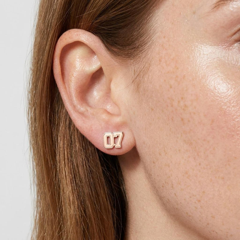 Pair of small gold sports jersey stud earrings with a number on the front (3 of 9)