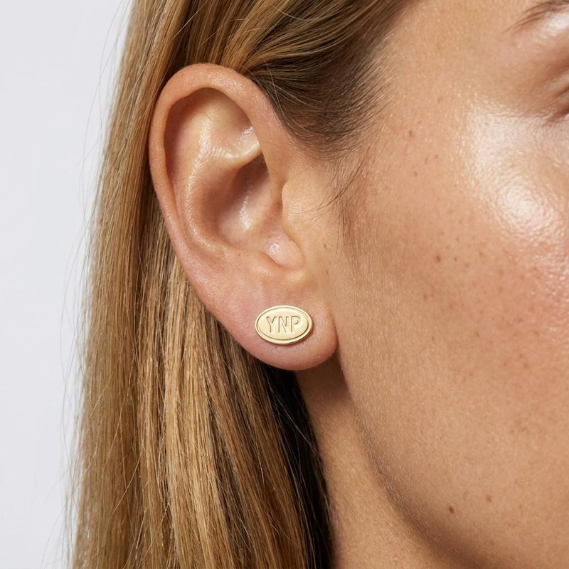 Pair of small gold oval stud earrings showing a Yellowstone landscape scene (2 of 5)
