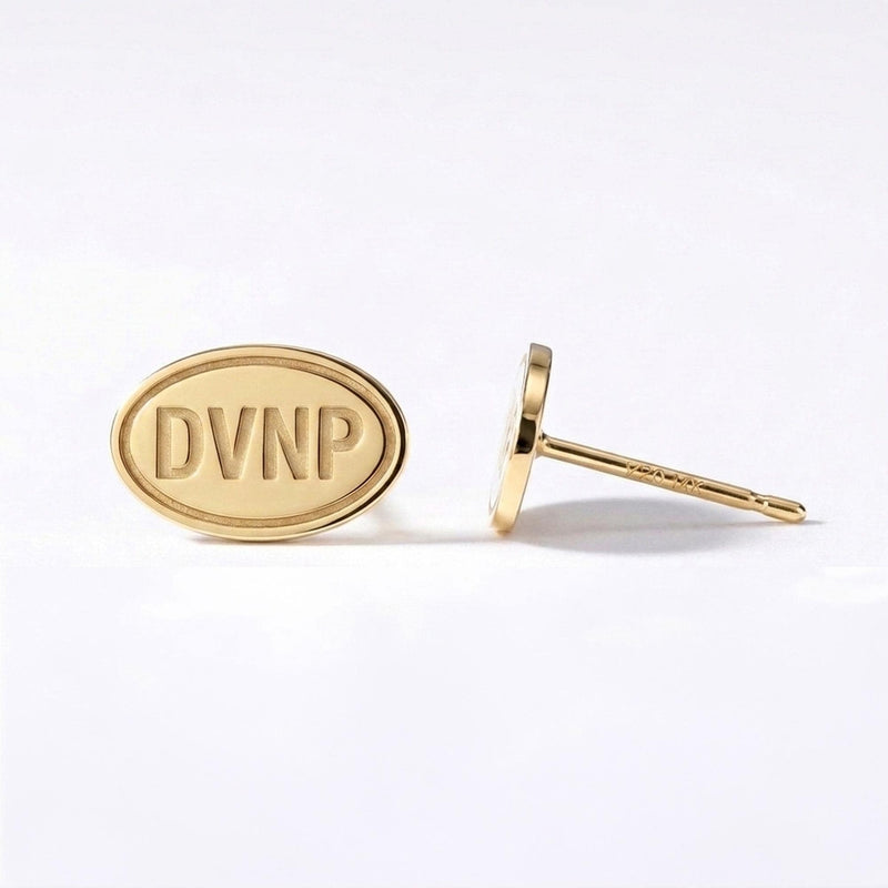 Pair of small gold oval stud earrings with a Death Valley desert scene