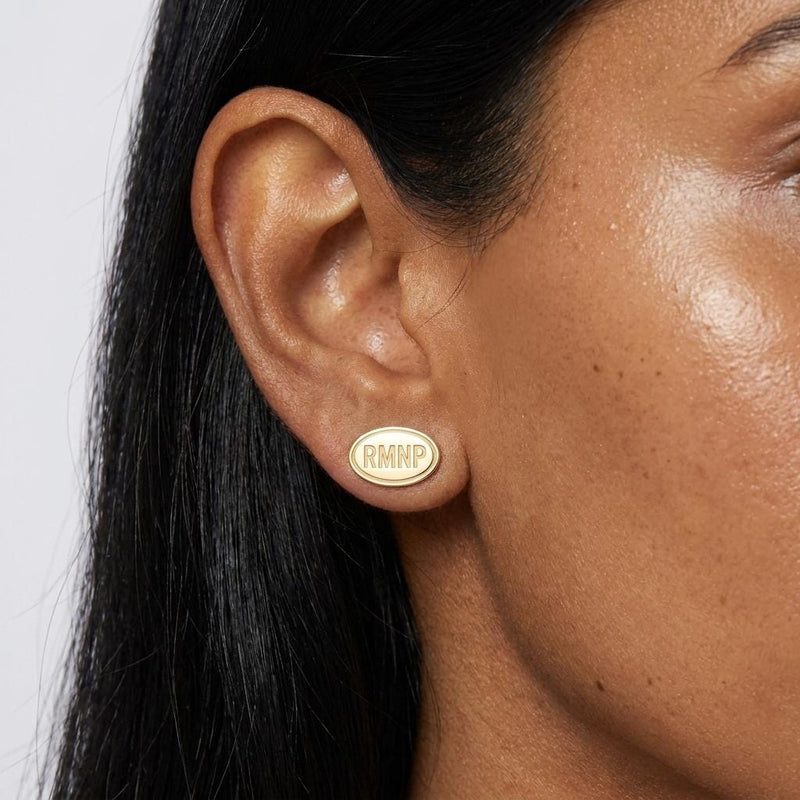 Pair of small gold oval stud earrings showing mountain peaks and evergreen trees (2 of 5)