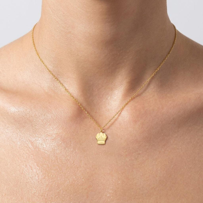 Small gold chef hat pendant on a fine cable chain