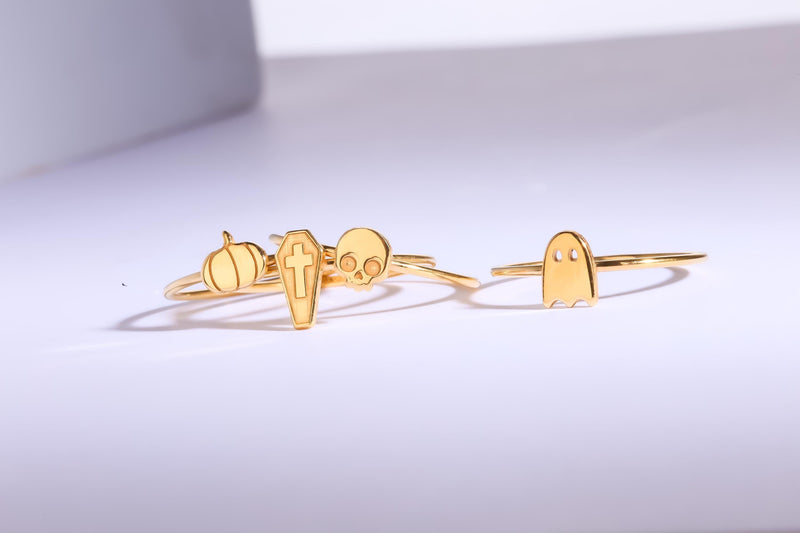 Thin gold ring topped with a small ribbed pumpkin charm with a curled stem (10 of 13)