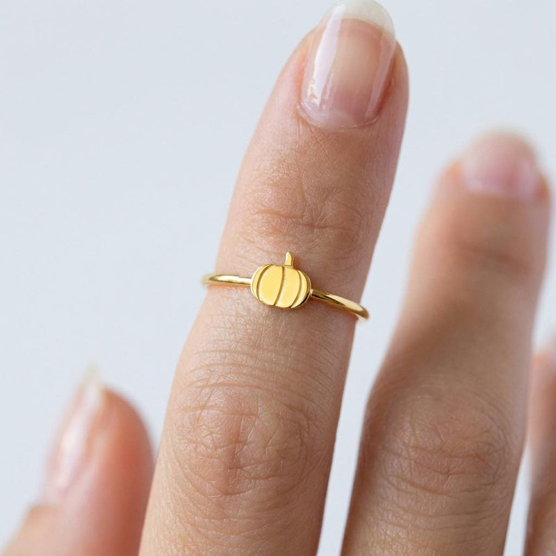 Thin gold ring topped with a small ribbed pumpkin charm with a curled stem (3 of 13)