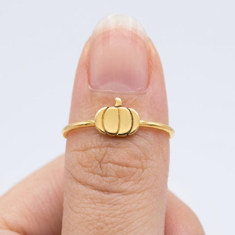 Thin gold ring topped with a small ribbed pumpkin charm with a curled stem (5 of 13)