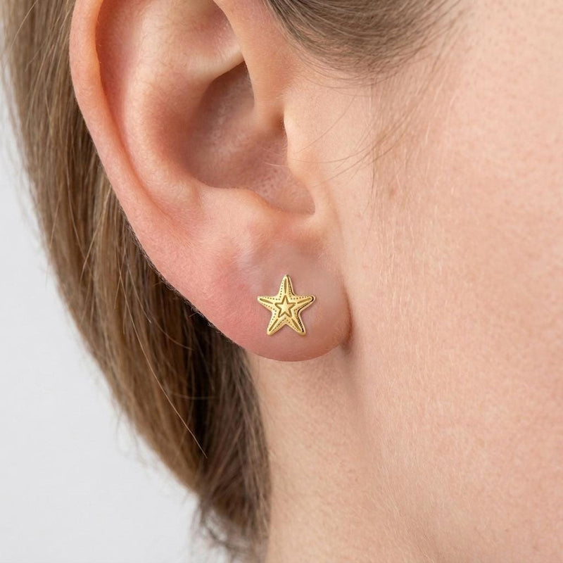 Pair of small gold five-armed starfish stud earrings (2 of 5)