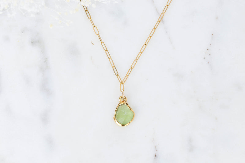 Raw Peridot Necklace on a white background