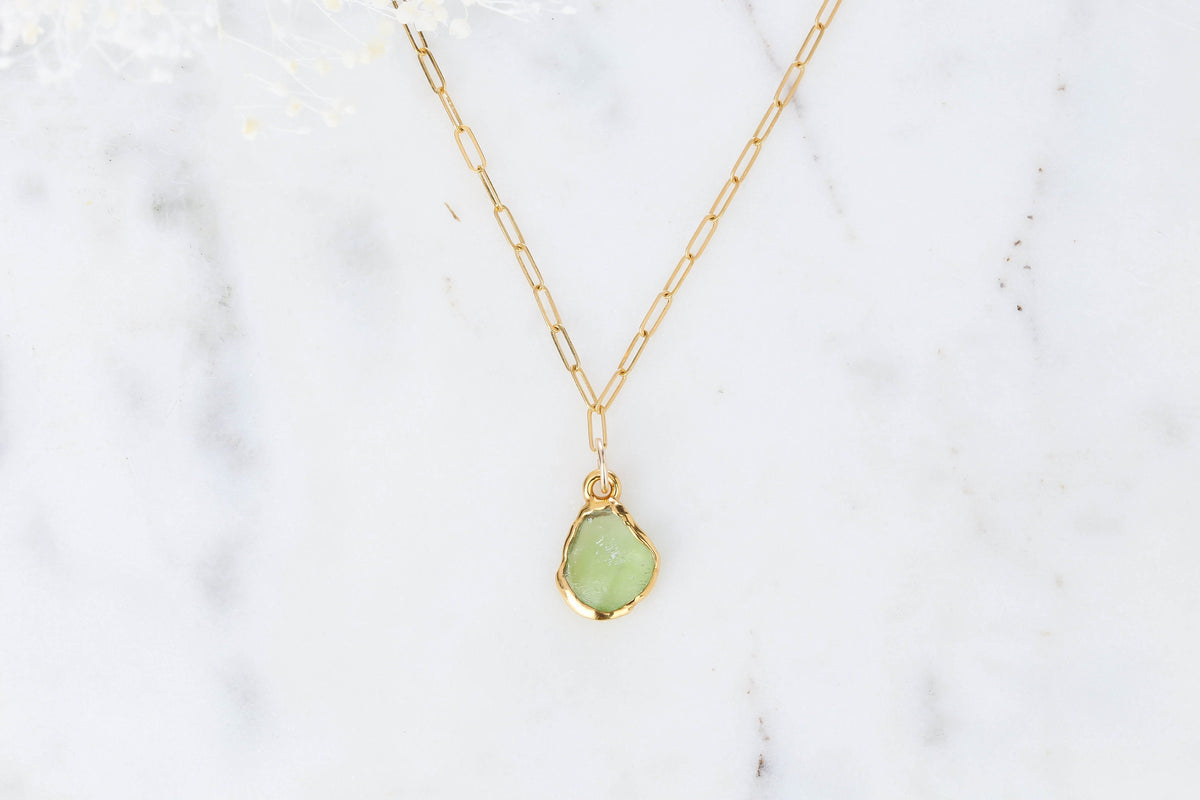 Raw Peridot Necklace, 24k gold, photographed on white