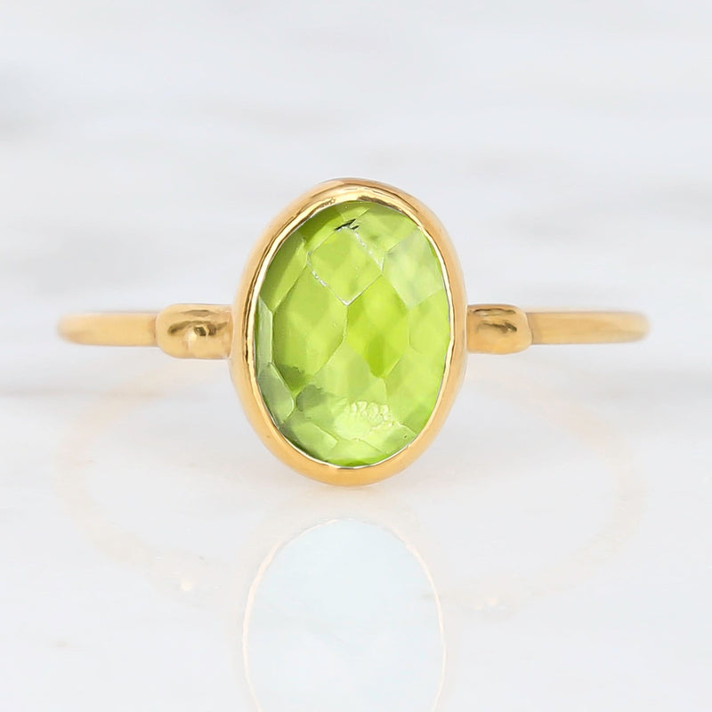 Raw Peridot Ring on a white background