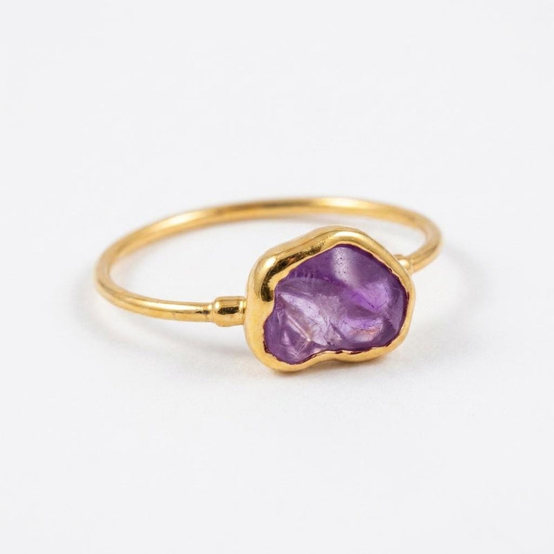 Raw Alexandrite Ring on a white background