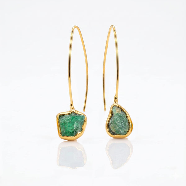 Raw Emerald Dangle Earrings on a white background