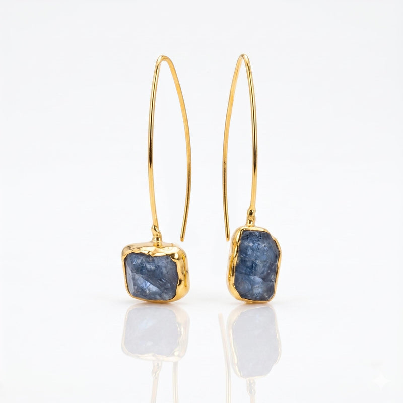 Raw Sapphire Dangle Earrings on a white background