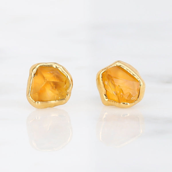 Mini Raw Citrine Stud Earrings on a white background
