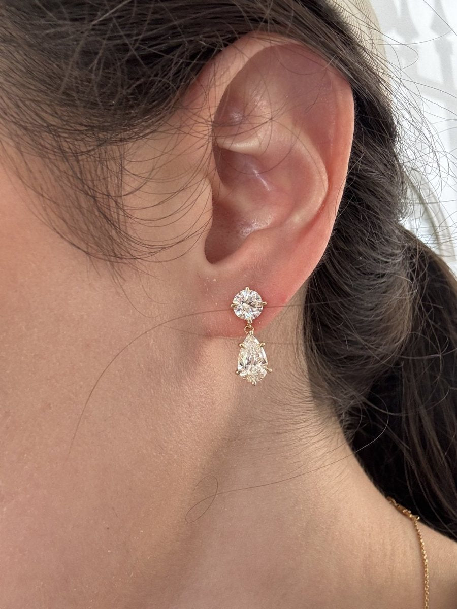 Drop earrings worn on an ear
