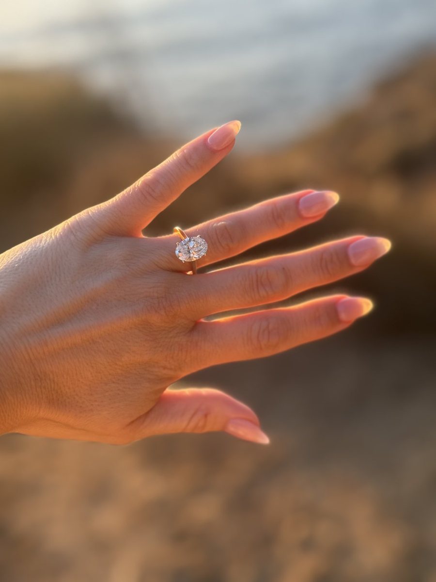 A ring worn on a hand outdoors